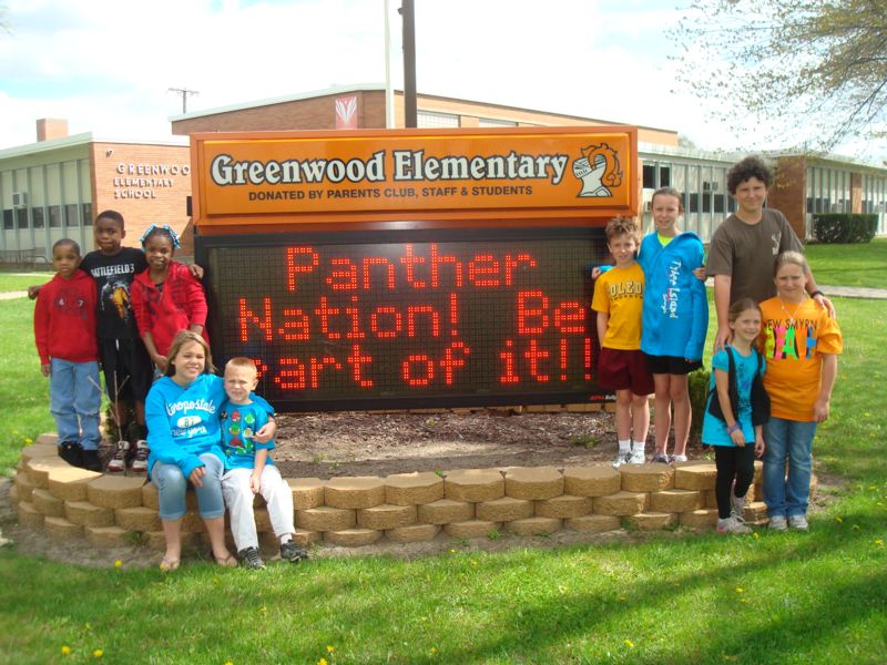 Greenwood Elementary - Panther Nation! Be Part of It! sign with students