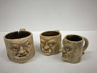 Three mugs with faces